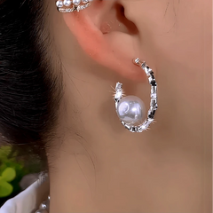 Close-up detail of the sparkling zircons and plating on the Pearl C-Shaped Earrings