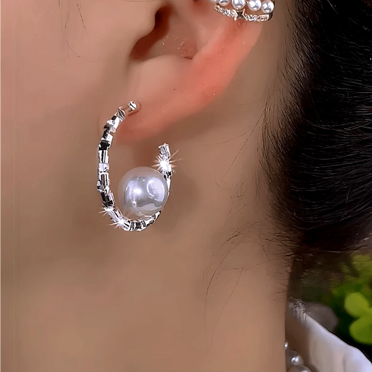 Model showcasing the dangle and style of the 14K Gold-Plated Elegant Broken Silver Pearl C-Shaped Earrings