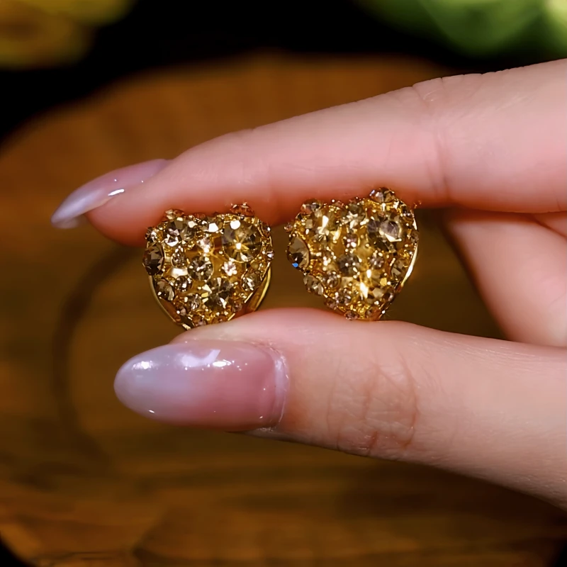 Close-up detail of the sparkling zircons and plating on the Double-Sided Heart Earrings