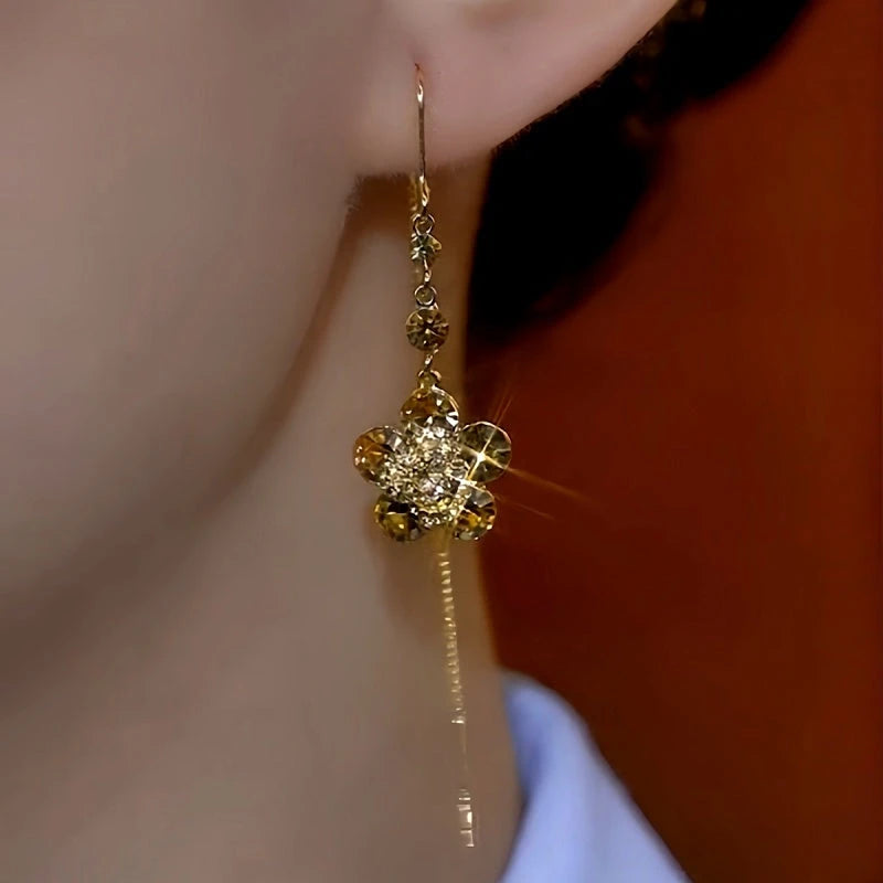 Close-up detail of the sparkling zircons and plating on the Flower Threader Earrings