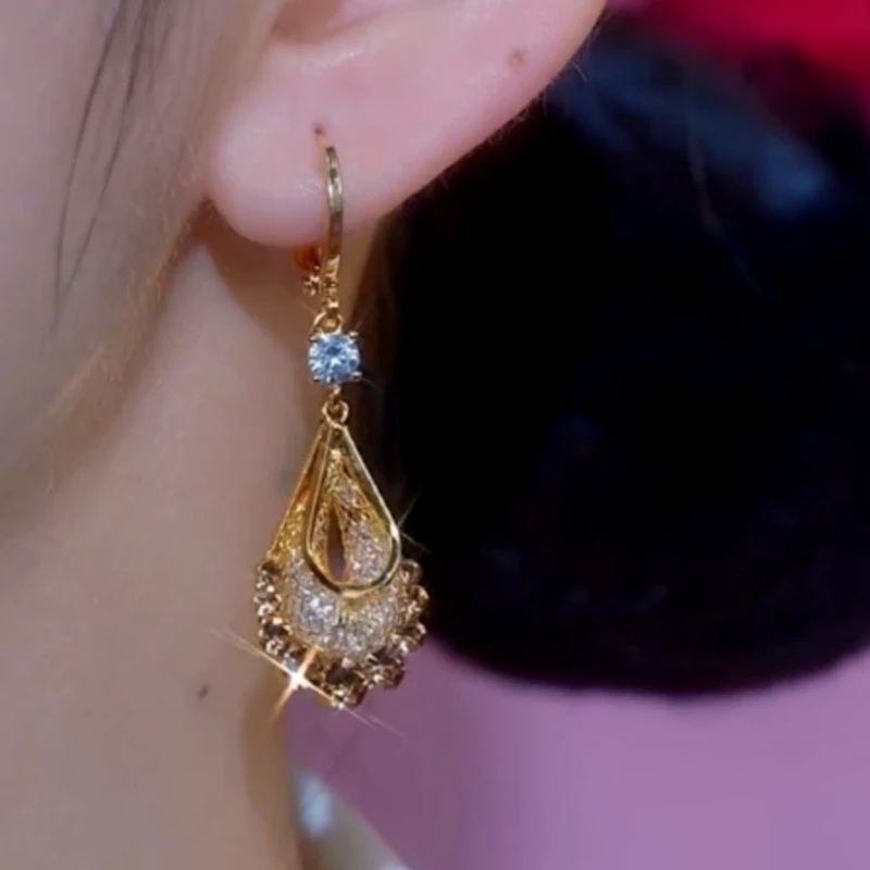 Close-up detail of the sparkling zircons and plating on the Mesh Drop Earrings