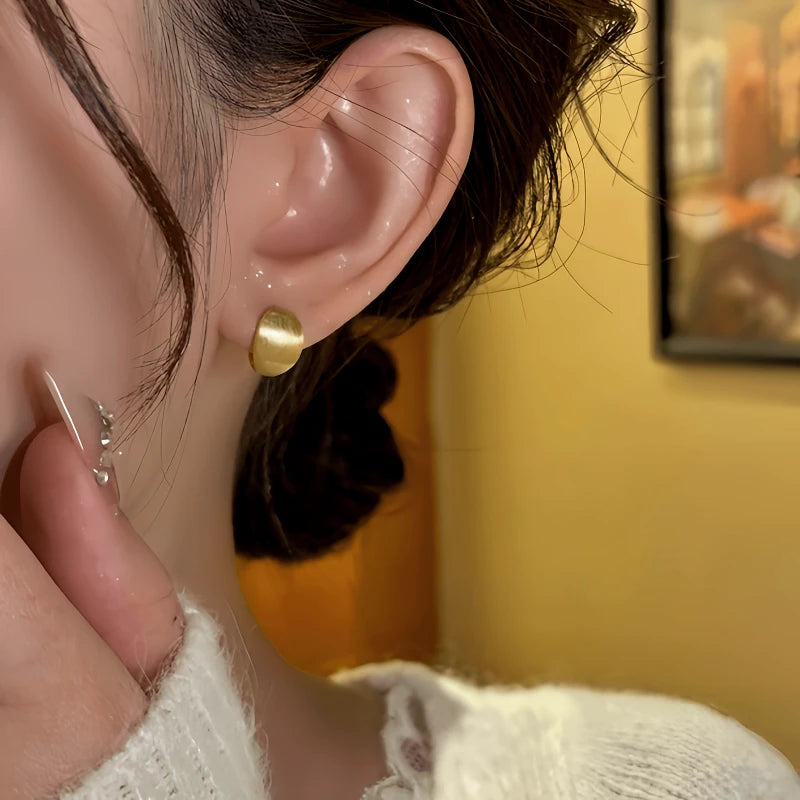 Close-up detail of the sparkling zircons and plating on the Geometric Hoop Earrings