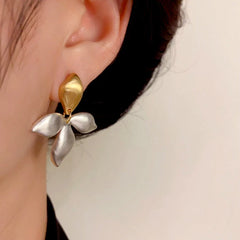 Close-up detail of the sparkling zircons and plating on the Two-Tone Leaf Earrings