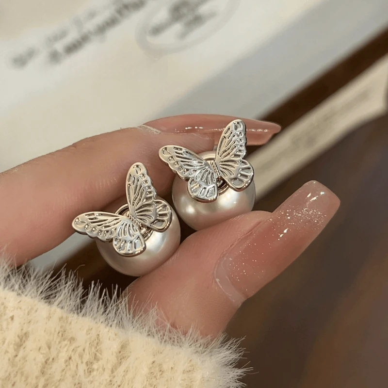 Angled view of the 14K Gold-Plated Elegant Butterfly Bead Earrings