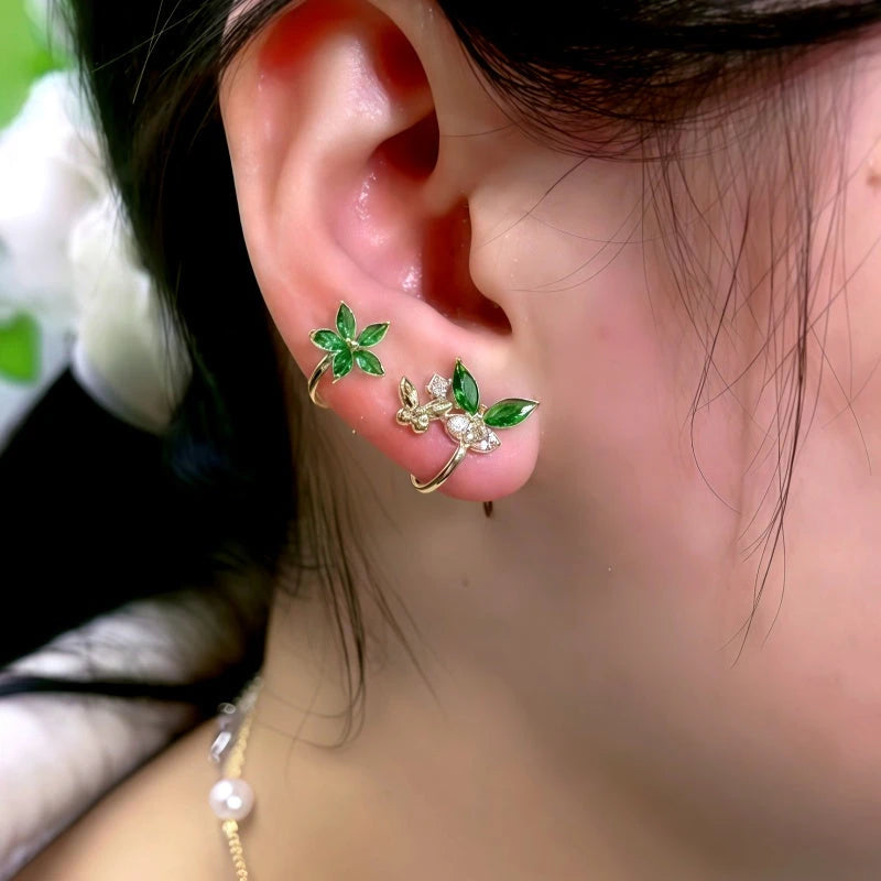 Model showcasing the dangle and style of the 14K Gold-Plated Elegant Zircon Butterfly Flower Stud Earrings