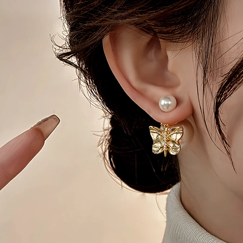 Angled view of the 14K Gold-Plated Elegant Butterfly Pearl Earrings