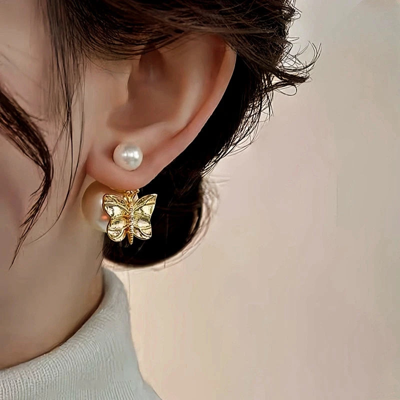 Close-up detail of the sparkling zircons and plating on the Butterfly Pearl Ear Jackets