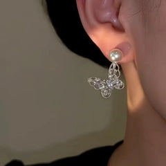 Close-up detail of the sparkling zircons and plating on the Butterfly Pearl Earrings