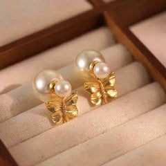 Model showcasing the dangle and style of the 14K Gold-Plated Elegant Butterfly Pearl Earrings