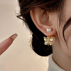Angled view of the 14K Gold-Plated Elegant Butterfly Pearl Earrings