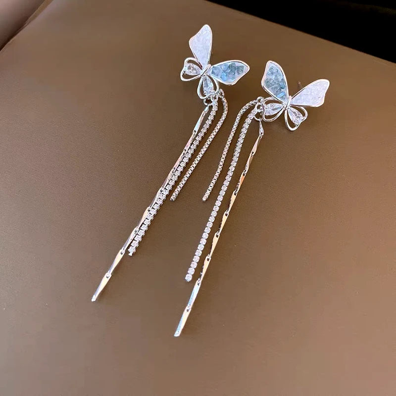 Angled view of the 14K Gold-Plated Elegant Butterfly Tassel Earrings