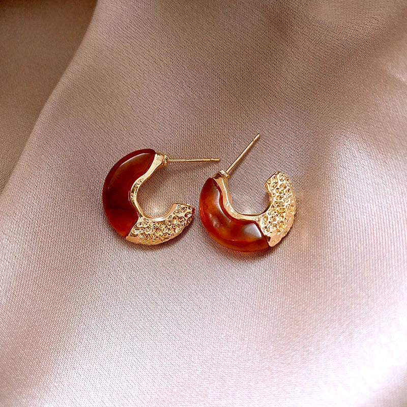 Angled view of the 14K Gold-Plated Elegant C-Ring Earrings