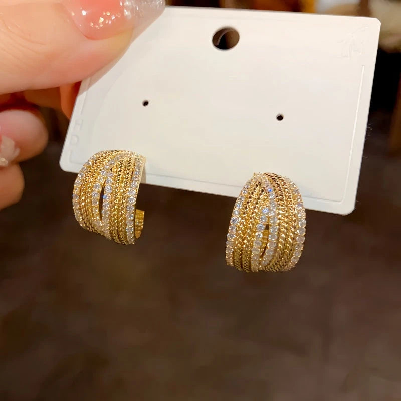 Angled view of the 14K Gold-Plated Elegant C-Shaped Diamond Earrings