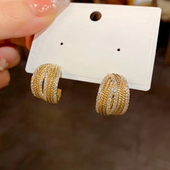 Angled view of the 14K Gold-Plated Elegant C-Shaped Diamond Earrings