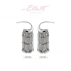 Model showcasing the dangle and style of the 14K Gold-Plated Elegant C-Shaped Tassel Earrings