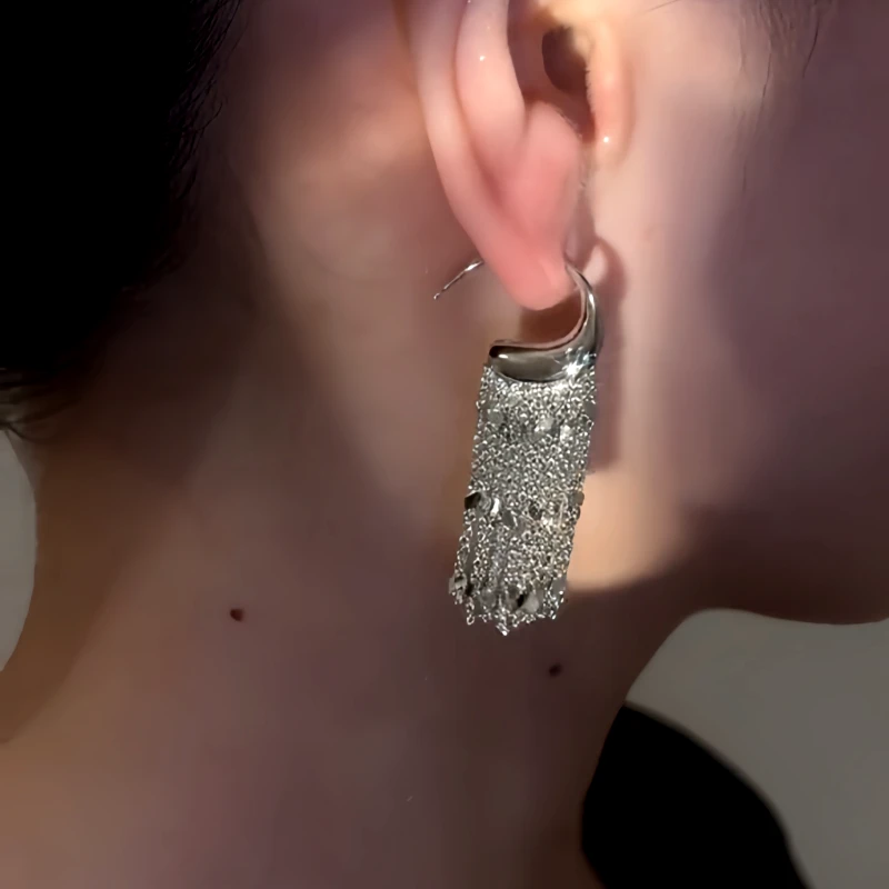 Angled view of the 14K Gold-Plated Elegant C-Shaped Tassel Earrings