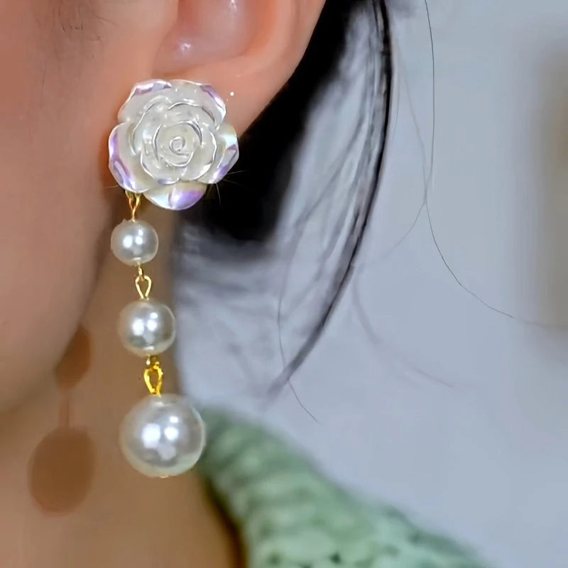 Close-up detail of the sparkling zircons and plating on the Camellia Tassel Earrings