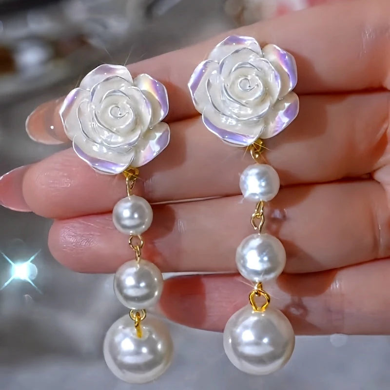 Angled view of the 14K Gold-Plated Elegant Camellia Bead Tassel Earrings