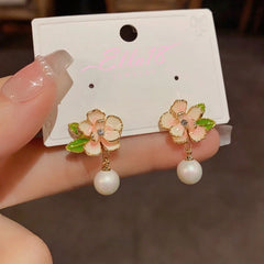 Angled view of the 14K Gold-Plated Elegant Camellia Pearl Earrings