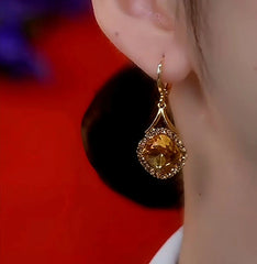 Close-up detail of the sparkling zircons and plating on the Caramel Zircon Earrings