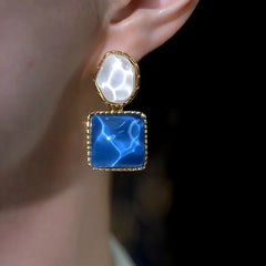 Close-up detail of the sparkling zircons and plating on the Asymmetrical Earrings