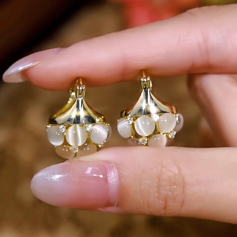 Close-up detail of the sparkling zircons and plating on the Cat's Eye Drop Earrings