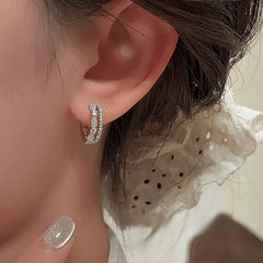 Model showcasing the dangle and style of the 14K Gold-Plated Elegant Cat's Eye Stone Double-Layer Hoop Earrings