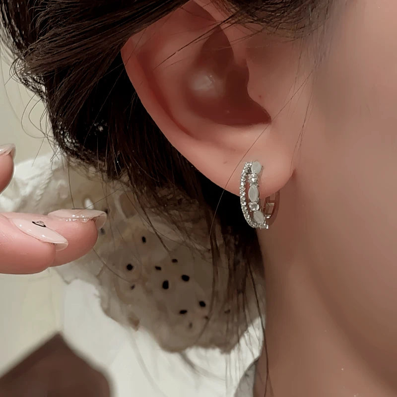 Close-up detail of the sparkling zircons and plating on the Double Layer Hoops