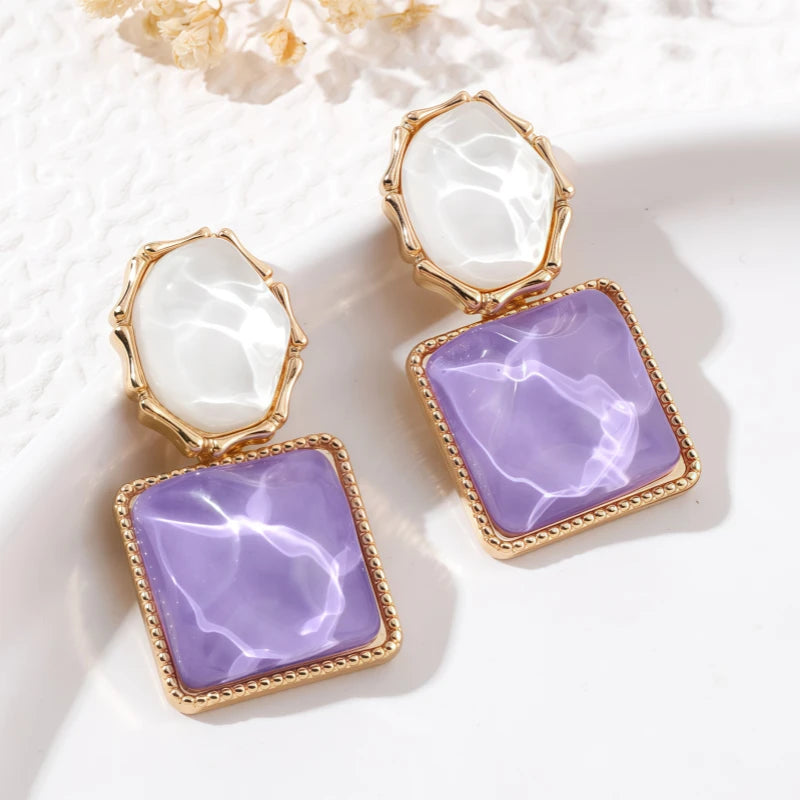 Close-up detail of the sparkling zircons and plating on the Pink Cat's Eye Earrings