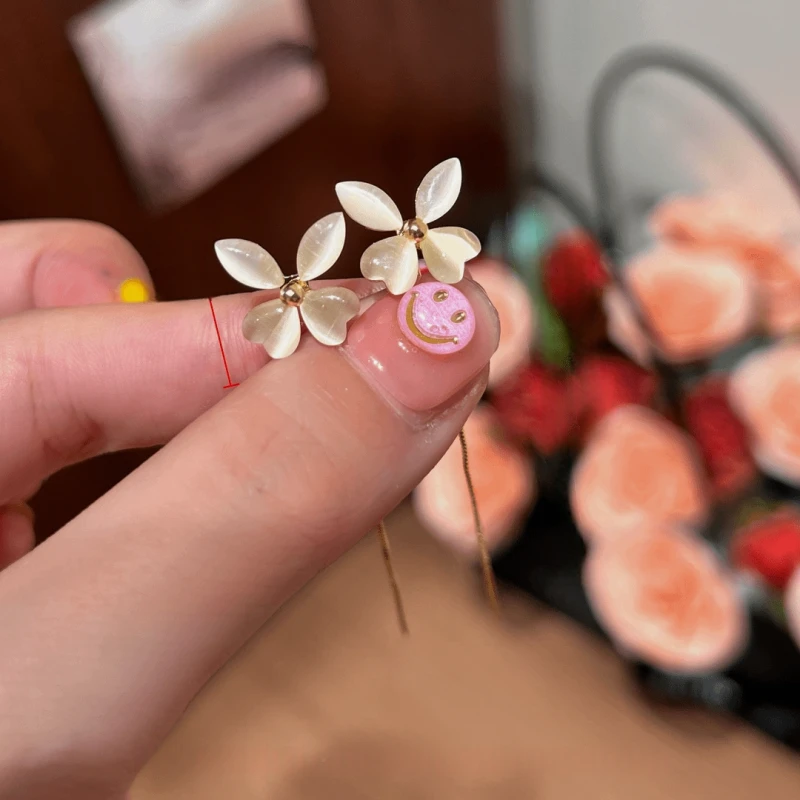 Angled view of the 14K Gold-Plated Elegant Cat's Eye Stone Flower Threader Earrings