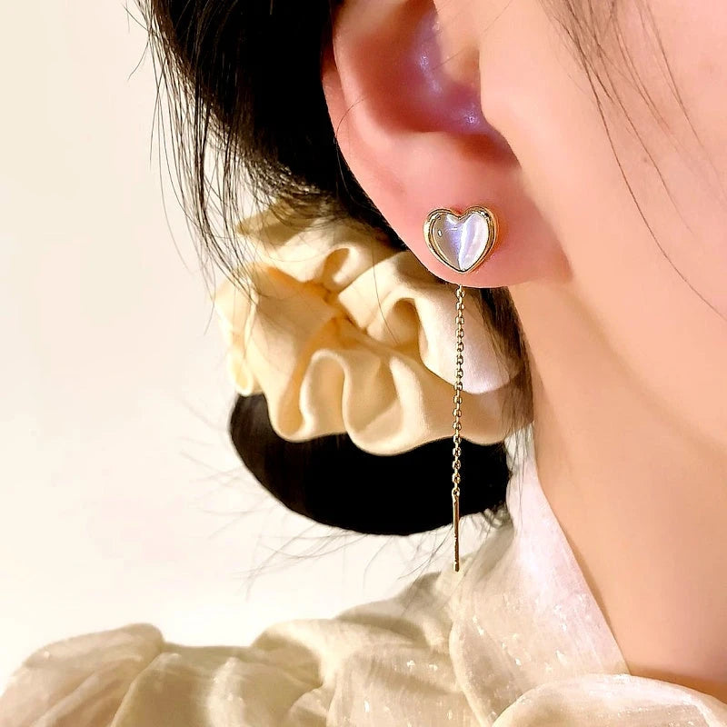 Close-up detail of the sparkling zircons and plating on the Heart Threader Earrings