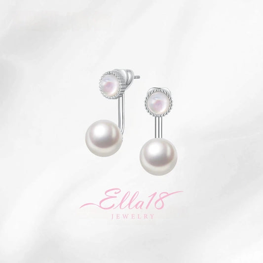 Model showcasing the dangle and style of the 14K Gold-Plated Elegant Cat's Eye Stone Mother Of Pearl Jacket Earrings