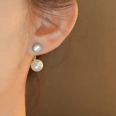 Angled view of the 14K Gold-Plated Elegant Cat's Eye Stone Mother Of Pearl Jacket Earrings