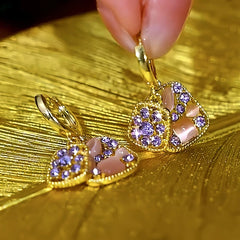 Close-up detail of the sparkling zircons and plating on the Purple Diamond Earrings