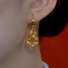 Close-up detail of the sparkling zircons and plating on the Cat's Eye Water Drop Earrings