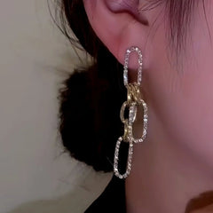 Close-up detail of the sparkling zircons and plating on the Chain Tassel Earrings