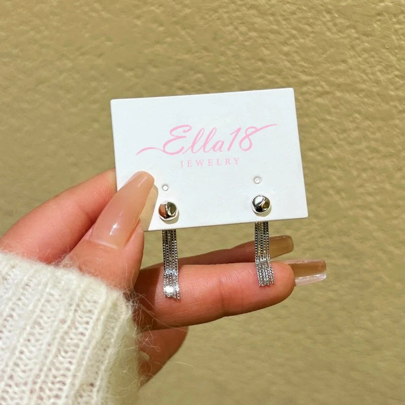 Angled view of the 14K Gold-Plated Elegant Chain Tassel Earrings