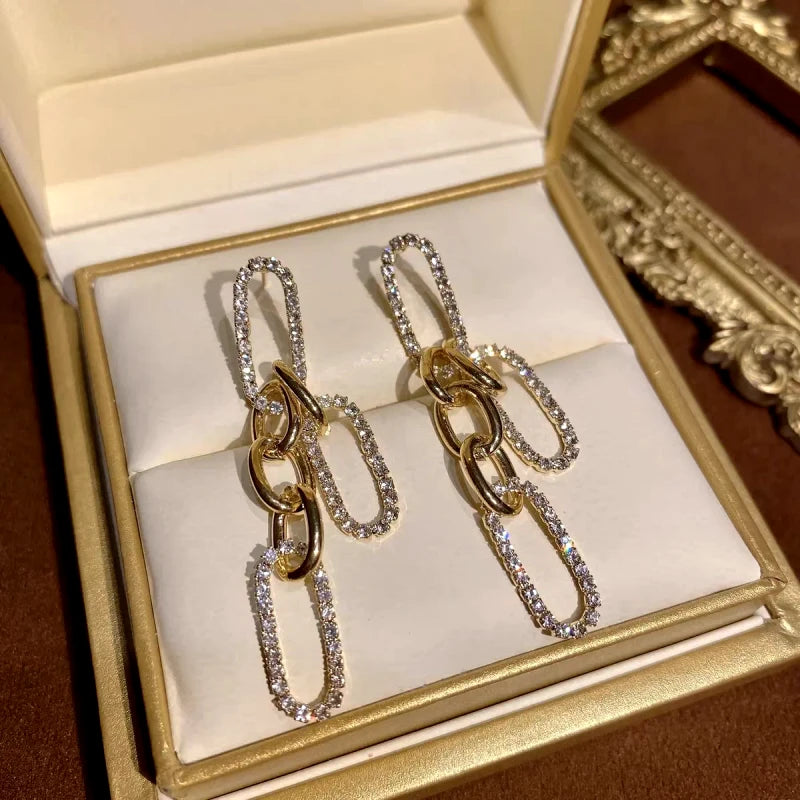 Angled view of the 14K Gold-Plated Elegant Chain Tassel Earrings