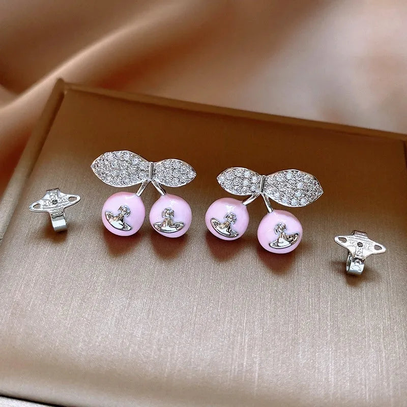 Angled view of the 14K Gold-Plated Elegant Cherry Saturn Earrings