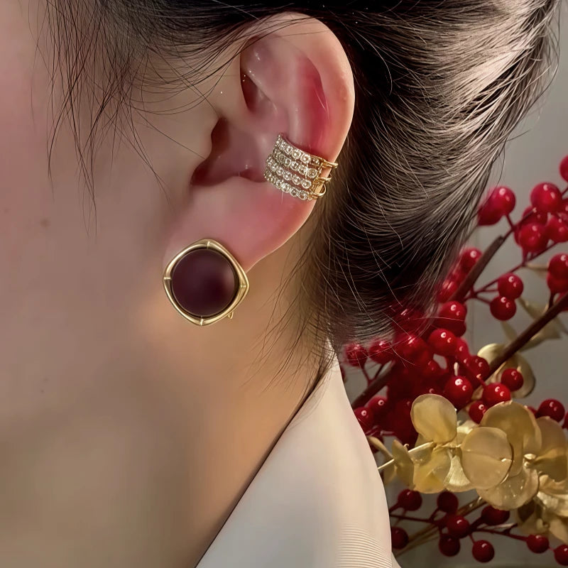 Model showcasing the dangle and style of the 14K Gold-Plated Elegant Chocolate Studs