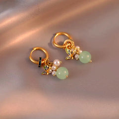 Close-up detail of the sparkling zircons and plating on the Butterfly Tassel Earrings