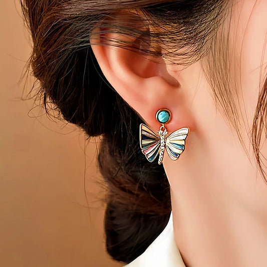 Model showcasing the dangle and style of the 14K Gold-Plated Elegant Colorful Butterfly Earrings