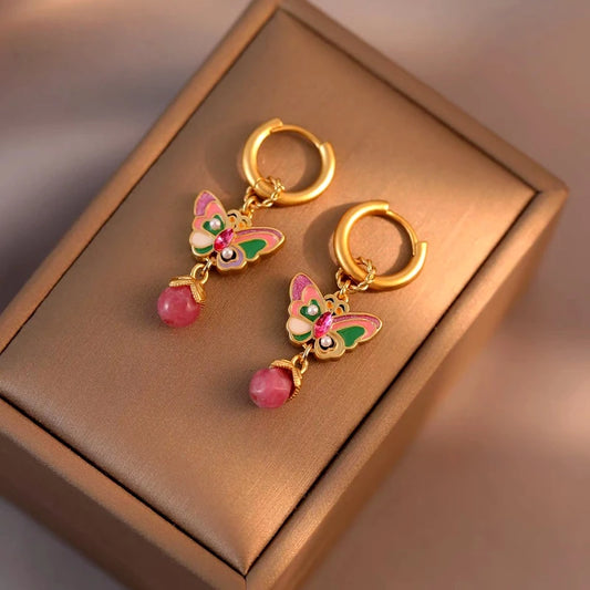 Model showcasing the dangle and style of the 14K Gold-Plated Elegant Colorful Butterfly Tassel Earrings