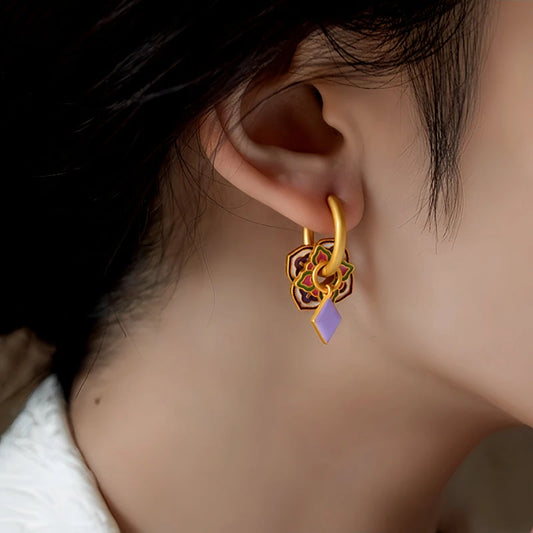 Model showcasing the dangle and style of the 14K Gold-Plated Elegant Colorful Enamel Design Earrings
