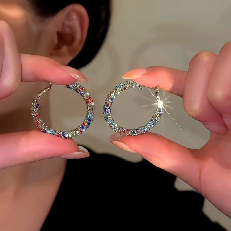 Model showcasing the dangle and style of the 14K Gold-Plated Elegant Colorful Hoop Earrings