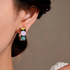 Model showcasing the dangle and style of the 14K Gold-Plated Elegant Colorful Smile Face C-Shaped Earrings