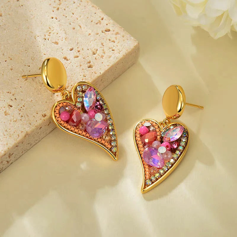 Model showcasing the dangle and style of the 14K Gold-Plated Elegant Colorful Zircon Diamond Heart Earrings
