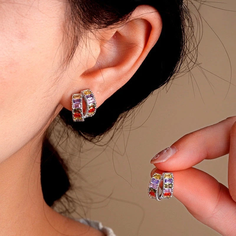 Model showcasing the dangle and style of the 14K Gold-Plated Elegant Colorful Zircon Double-Layer Stud Earrings