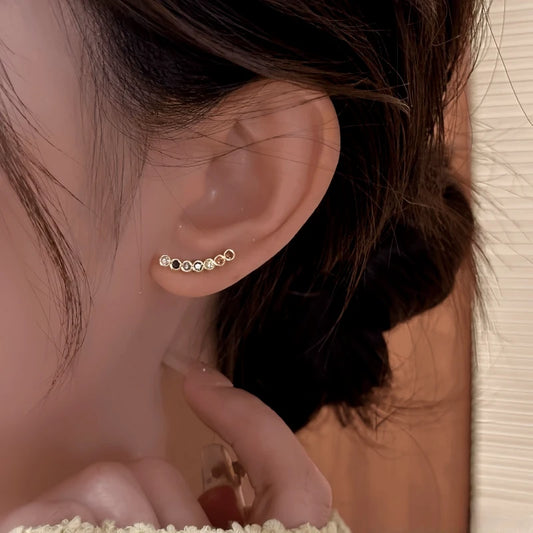 Model showcasing the dangle and style of the 14K Gold-Plated Elegant Colorful Zircon Smile Face Stud Earrings