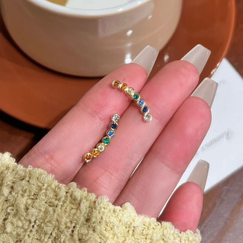 Angled view of the 14K Gold-Plated Elegant Colorful Zircon Smile Face Stud Earrings